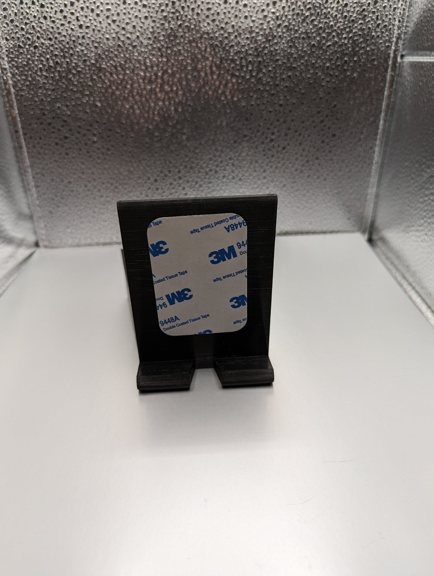 A black 3D printed phone mount for a Dodge Ram vehicle, showing the front side of the mount where users phone sits